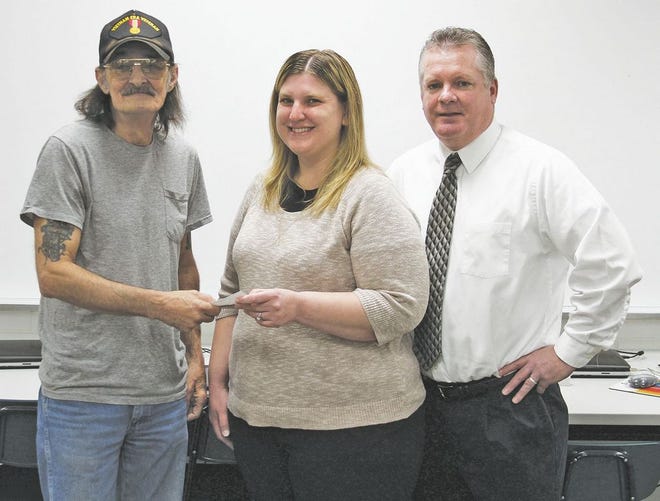In this file photo from Nov. 23, 2016, Bill Scripko, left, gives a check for over $800 to Holly Crittenden, the COPESD MoCI class teacher who taught his granddaughter before she passed away at age 17 from complications of a rare chromosome disorder. Pictured at right is Jeff Reinelt, supervisor of special education at the COPESD. Scripko organized the bowling tournament last year to give back to the classroom that Margaret was a part of, and will hold the tournament again this year on Sunday, Nov. 12.