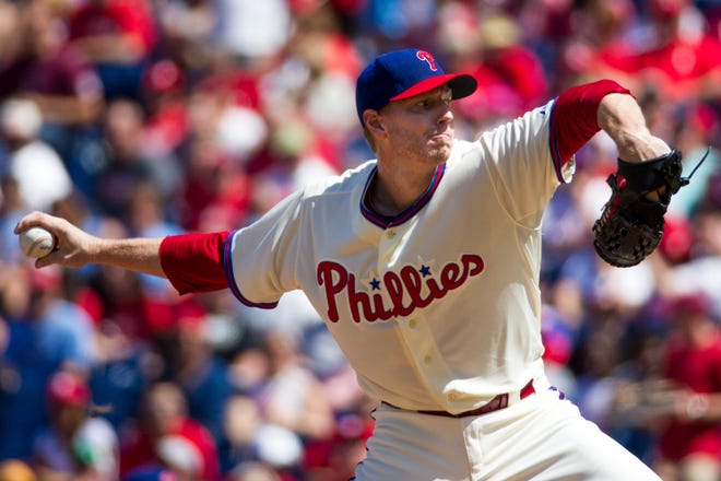 In this Aug. 24, 2013, file photo, Philadelphia Phillies starting pitcher Roy Halladay throws a pitch during the first inning of a game against the Arizona Diamondbacks in Philadelphia.