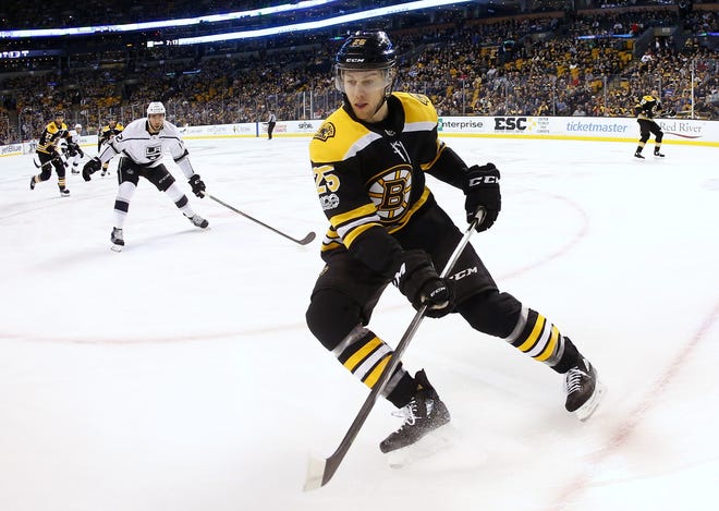 Bruins defenseman Brandon Carlo has played the past eight games with Torey Krug after spending the majority of last year paired up with Zdeno Chara. [AP Photo/Winslow Townson]