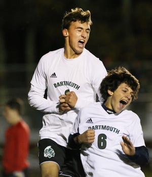 Dartmouth's Isaac Sequeira, left, celebrates his first of four goals on the night with teammate Cody Santo. The Indians went on to beat Bishop Feehan 5-0. [MIKE VALERI/THE STANDARD-TIMES/SCMG]