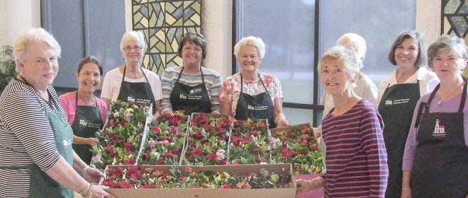 Trent woods Garden Club arrange flowers for Meals on Wheels recipients. [Submitted photo]