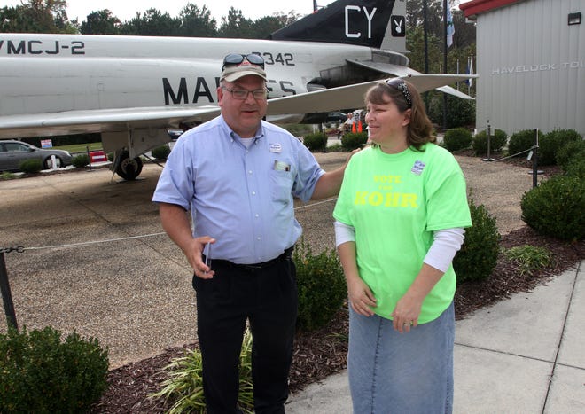 Candidate Jim Kohr and wife Susan campaign Tuesday at the Havelock Tourist and Event Center polling location. Kohr won a seat on the Havelock Board of Commissioners in unofficial results. [GRAY WHITLEY / SUN JOURNAL STAFF]