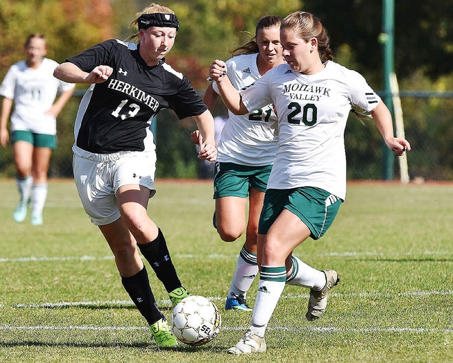 Herkimer County Community College’s Mikayla Blumenstock, left, of Poland battles Mohawk Valley Community College’s Elisha Hamilton of Remsen for possession during their game last month. Blumenstock is third in the nation with 32 goals and 85 points for the Generals. [SARAH CONDON/OBSERVER-DISPATCH]