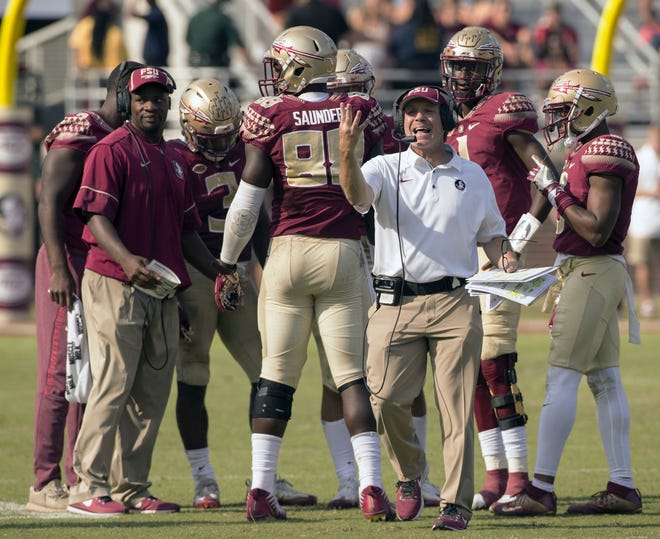 Florida State head coach Jimbo Fisher comes out of the huddle looking for the referee in the second half of an NCAA college football game against Syracuse in Tallahassee on Saturday. [MARK WALLHEISER/AP PHOTO]