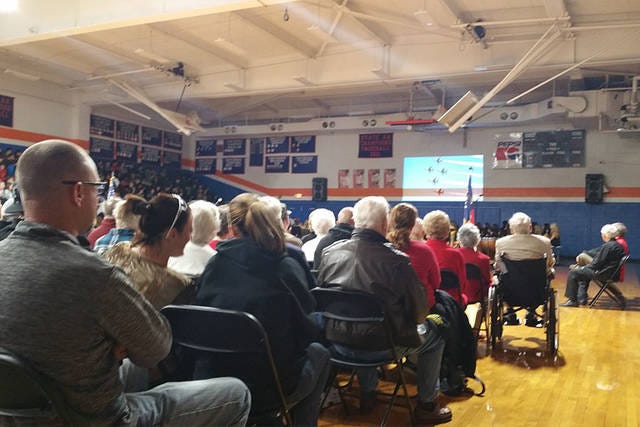HONORED GUESTS — More than 100 veterans at Randleman High School watch a video presentation honoring them and their fellow service men and women. (Micki Bare / The Courier-Tribune)