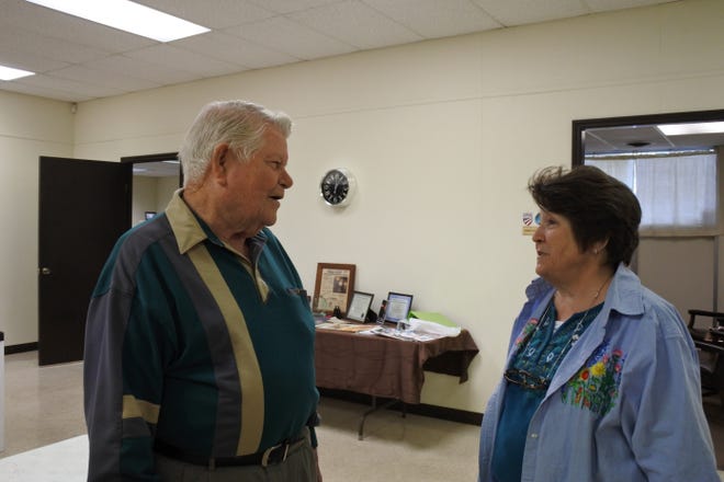 Clyde Chaney, director and truck driver for the Golden Rule Clothes Closet and More, left, and Beth Miller, treasurer of the Golden Rule, speak after a meeting of the Golden Rule board of directors at the Community Services Clearinghouse in Fort Smith on Wednesday, Nov. 8, 2017. [THOMAS SACCENTE/TIMES RECORD]