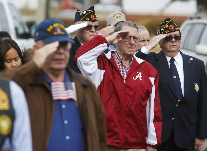 Veterans salute the flag as the National Anthem is played during the Veterans Day observance in Tuscaloosa Veterans Memorial Park Friday, November 11, 2016. Staff Photo/Gary Cosby Jr.