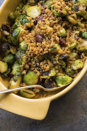 Pan-roasted Brussels sprouts with chorizo and toasted bread crumbs from a recipe by Katie Workman. (Sarah Crowder via AP)