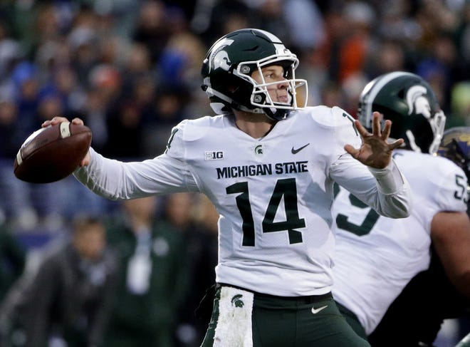 Michigan State quarterback Brian Lewerke looks to pass against Northwestern during the second half of an NCAA college football game in Evanston, Ill., Saturday, Oct. 28, 2017. (AP Photo/Nam Y. Huh)