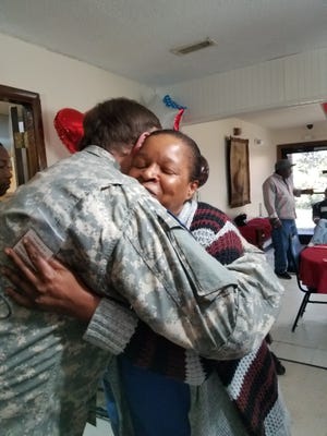 Hospice Cleveland County chaplain Terry Floyd hugs Kings Mountain Care Center staff member Jackie Delamonico, who served in the National Guard. Hospice Cleveland County recently honored six local veterans at Kings Mountain Care Center. [Special to The Star]