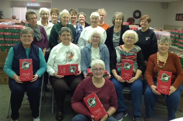 SUBMITTED PHOTO

This group from Broadway United Methodist Church in New Philadelphia holds some of the gift boxes for Operation Christmas Child.