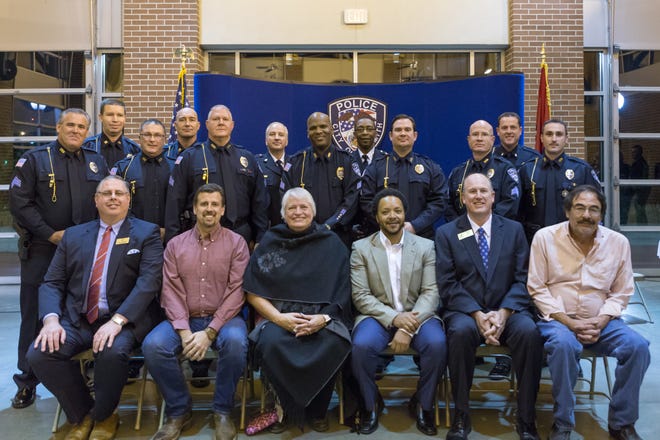 Seven Fort Smith police officers were promoted Thursday, Nov. 9, 2017. Back row, from left: Sgt. Robert Schibbelhut, Capt. Waymon Parker, Sgt. Lee McGabe, Capt. Brian Rice, Sgt. Jeff Carter, Maj. Larry Ranells, Sgt. Wendall Sampson, Chief Nathaniel Clark, Sgt. Stephen Krumm, Sgt. Scott Jackson, Lt. Daniel Grubbs and Sgt. Anthony Parkinson. Front row, from left: City Aministrator Carl Geffken, Ward 3 Director Mike Lorenz, At-large Director Tracy Pennartz, Ward 2 Andre Good, At-large Director and Vice Mayor Kevin Settle and Ward 4 Director George Catsavis. [COURTESY OF FORT SMITH POLICE DEPARTMENT]