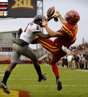 Oklahoma State cornerback Rodarius Williams (8) breaks up a pass intended for Iowa State wide receiver Allen Lazard, right, in the end zone during the second half Saturday, Nov. 11, 2017, in Ames, Iowa. Oklahoma State won 49-42. [AP Photo/Charlie Neibergall]