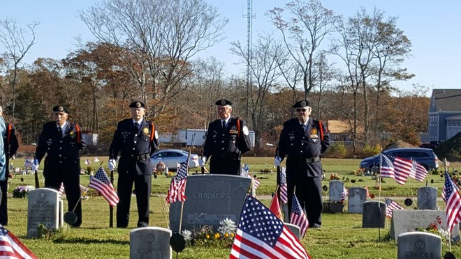 Members of the Vietnam Veterans of America prepare for a 21-gun salute.