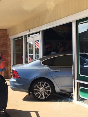 A woman accidentally drove her new Volvo into PS Gifts Monday morning. [TONY JUDNICH/DAILY NEWS]
