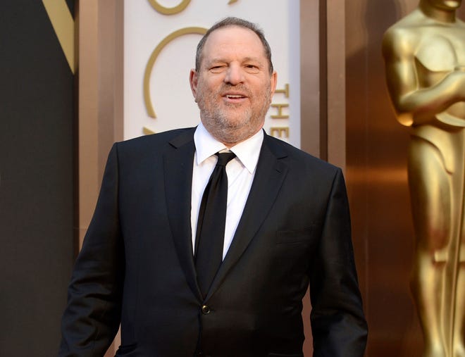 FILE - In this March 2, 2014 file photo, Harvey Weinstein arrives at the Oscars in Los Angeles. The sexual harassment and assault allegations against Weinstein that rocked Hollywood and sparked a flurry of allegations in other American industries, as well as the political arena, are reaching far beyond U.S. borders. Emboldened by the women, and men, who have spoken up, the "Weinstein Effect" is rippling across the globe. (Photo by Jordan Strauss/Invision/AP, File)