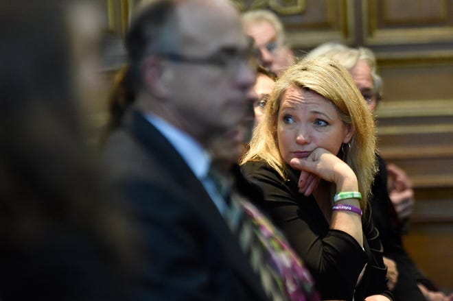 Nicole Hockley, who lost her son, Dylan in the 2012 Sandy Hook School shooting, waits in the gallery at the state Supreme Court to hear arguments in a lawsuit filed against Remington Arms, in Hartford, Conn., Tuesday, Nov. 14, 2017.  A survivor and relatives of nine people killed in the shooting are trying to sue the North Carolina company that made the AR-15-style rifle used to kill 20 first-graders and six educators at Sandy Hook Elementary School. A lower court dismissed the lawsuit. (Cloe Poisson/The Courant via AP, Pool)