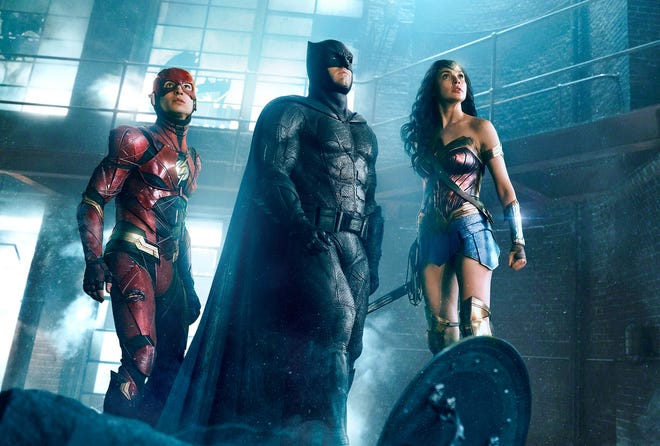 The Flash, Batman, and Wonder Woman look ... up in the sky in “Justice League.” [Warner Bros.]