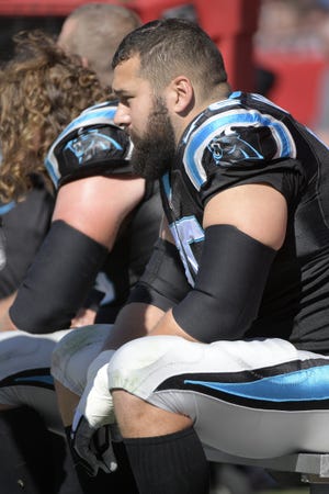 Carolina Panthers offensive tackle Matt Kalil (75) watches from the bench during the second half of an NFL football game against the Tampa Bay Buccaneers Sunday, Oct. 29, 2017, in Tampa, Fla. The Panthers won 17-3. (AP Photo/Phelan M. Ebenhack)