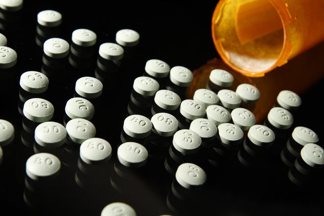OxyContin, in 80 mg pills, in a 2013 file image. A 2017 shows that repealing the Affordable Care Act would cut $5.5 billion a year for substance-abuse and mental health treatment, creating a 50 percent spike in the number of people unable to address their opioid dependence. (Liz O. Baylen/Los Angeles Times/TNS)