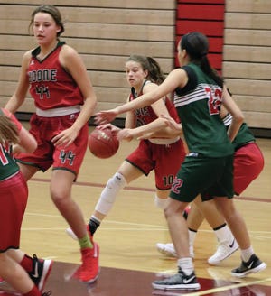 Mady Danner dribbles around Aliyah Graham as Lilly Lyons sets up in the lane during a recent Boone girls’ basketball practice. The Toreadors return their top three scorers from last season’s 19-6 State Tournament squad. Photo by Andrew Logue/News-Republican