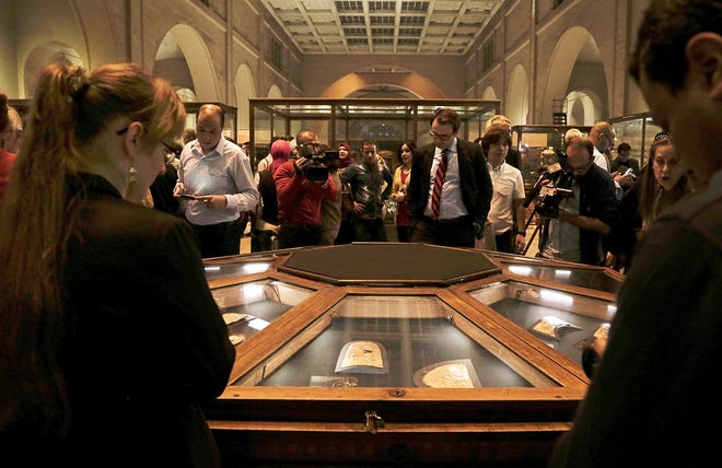 Ancient Egyptian artifects displayed in glass cases during the opening of the exhibition entitled Tutankhamun's Unseen Treasures marking the 115th anniversary of the Egyptian museum in Cairo, Egypt, Wednesday, Nov. 15, 2017. Egypt has displayed for the first time some previously unseen artefacts of the Pharaoh, famous for his tomb full of golden treasures. (AP Photo/Nariman El-Mofty)