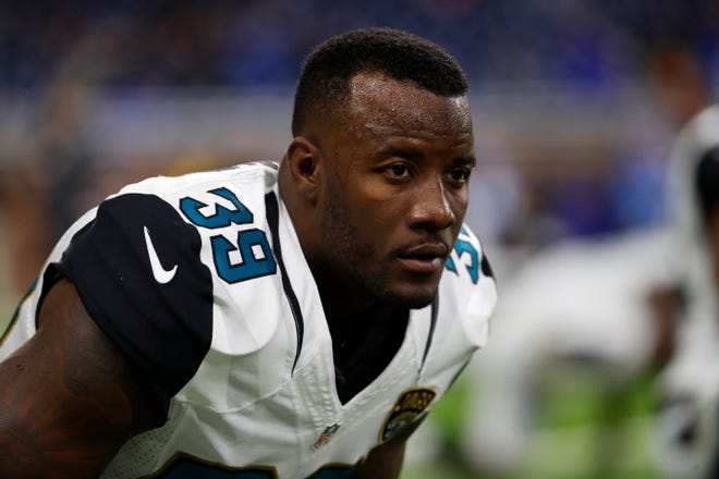 In this Nov. 20, 2016, file photo, Jacksonville Jaguars free safety Tashaun Gipson stretches during warmups before a game against the Detroit Lions in Detroit. Leaving Cleveland for a five-year contract carrying $12 million guaranteed, Gipson came to Jacksonville to fill a hole at free safety as part of an aggressive offseason makeover of the defense by the Jaguars. Gipson, who totaled 14 interceptions over his first four seasons with the Browns, picked off only one pass and expressed frustration with the conservative way he was used. (AP Photo/Paul Sancya, File)
