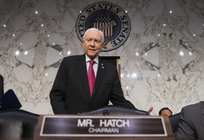 Senate Finance Committee Chairman Orrin Hatch, R-Utah, arrives as the tax-writing panel begins work Nov. 13 on overhauling the nation's tax code, on Capitol Hill in Washington. [J. Scott Applewhite/Associated Press File]
