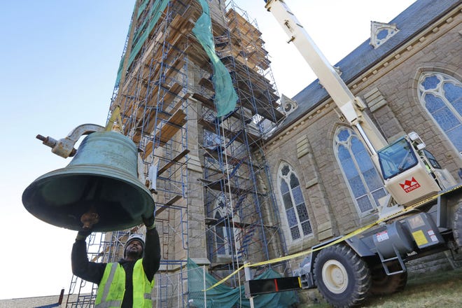 A#1 Crane Co. crews remove the 14 bells from St. Lawrence Martyr Church on County Street in New Bedford. 

[ PETER PEREIRA/THE STANDARD-TIMES/SCMG ]