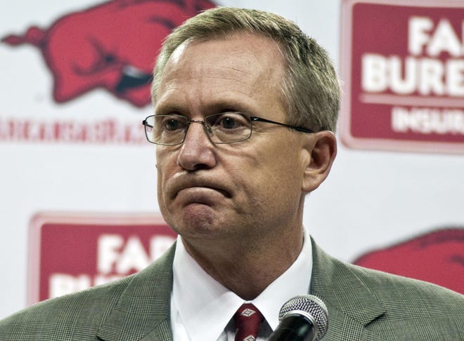 Arkansas athletic director Jeff Long listens to a question during a news conference in Fayetteville where he announced that Arkansas football coach Bobby Petrino had been terminated in April 2012. Arkansas has announced the firing of athletic director Jeff Long, Wednesday, Nov. 15, 2017, after nearly 10 years at the school. (AP Photo/April L. Brown, File)