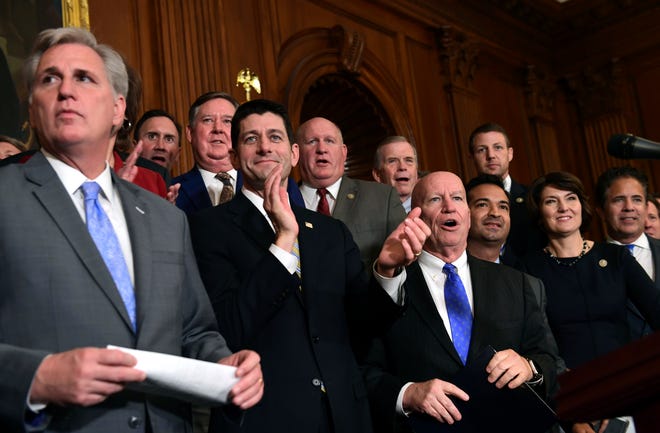 House Republicans, including House Majority Leader Kevin McCarthy (left), of California; and House Speaker Paul Ryan (second from left), of Wisconsin, wait to start a news conference following a vote on tax reform on Capitol Hill in Washington on Thursday, Nov. 16, 2017. Republicans passed a near $1.5 trillion package overhauling corporate and personal taxes through the House, edging President Donald Trump and the GOP toward their first big legislative triumph in a year in which they and their voters expected much more. [SUSAN WALSH / ASSOCIATED PRESS]