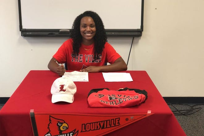 A CARDINAL - Charley Butler signed a softball scholarship with Louisville.