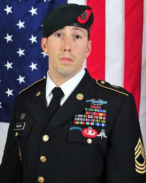 This undated photo provided by the U.S. Army shows Sgt. Peter Andrew McKenna Jr. An Army Green Beret from Rhode Island, McKenna was killed in Afghanistan about a month after he was honored at the historic Fourth of July parade in his hometown of Bristol, R.I. The 7th Special Forces Group to which he was assigned said Sunday that McKenna Jr., 35, died Friday in Kabul during an attack on a NATO facility. The Pentagon said he was struck by enemy small arms fire. (U.S. Army via AP)