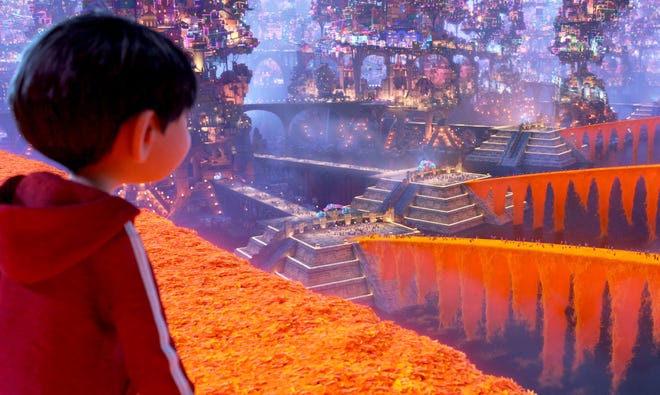 In “Coco,” Miguel finds himself in the Land of the Dead, featuring bridges of marigold petals. (Walt Disney Pictures-Pixar Animation Studios)