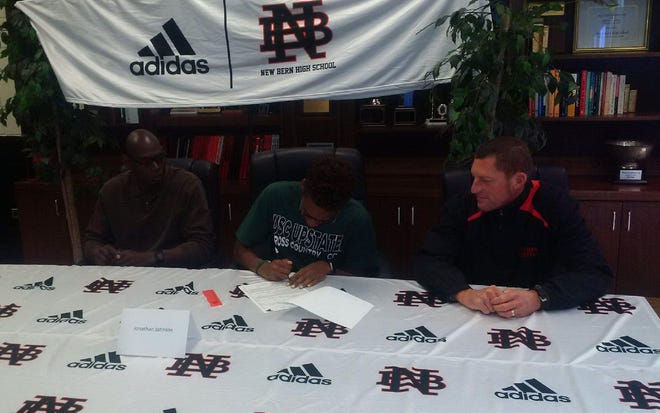 New Bern cross country and track and field senior Jonathan Johnson signed Wednesday to run for USC-Upstate. Johnson was joined by his father, Russell (left) and New Bern coach Mark Robinson as he signed at the high school. [Submitted photo]