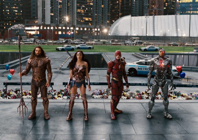 This image released by Warner Bros. Pictures shows Jason Momoa, from left, Gal Gadot, Ezra Miller and Ray Fisher in a scene from "Justice League." (Warner Bros. Entertainment Inc. via AP)