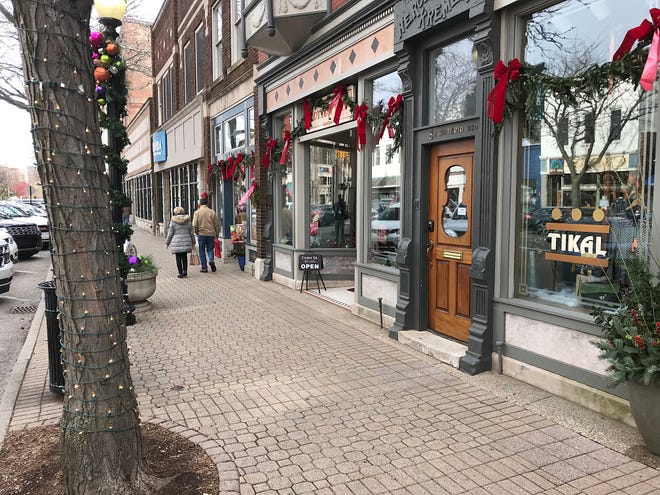 Holiday decorating in downtown Holland is in full swing as trees and light posts throughout Eighth Street have been covered in Christmas lights. Visit downtown Holland on Nov. 18 for the Holiday Open House. [Austin Metz/Sentinel Staff]