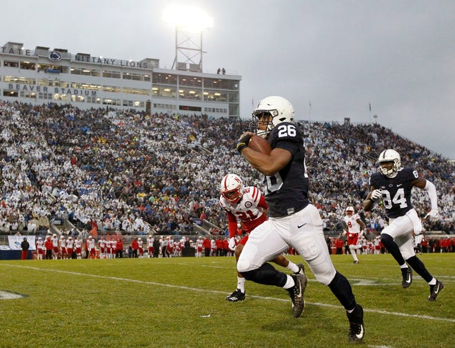 Penn State running back Saquon Barkley takes the ball 65 yards for a touchdown against Nebraska on Saturday in State College. (Chris Knight/Associated Press)