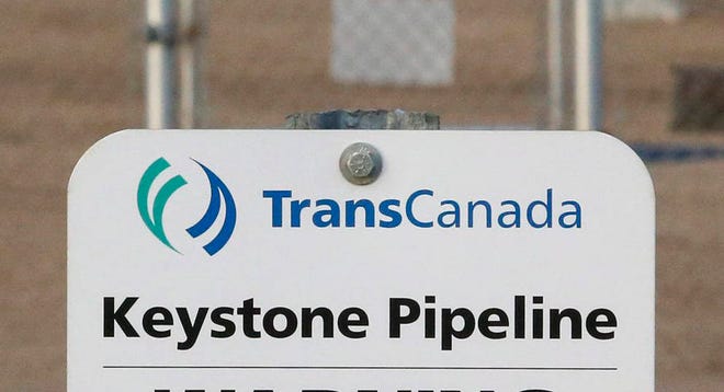 FILE- This Nov. 6, 2015, file photo shows a sign for TransCanada’s Keystone pipeline facilities in Hardisty, Alberta, Canada. TransCanada Corp.’s Keystone pipeline leaked oil onto agricultural land in northeastern South Dakota, the company and state regulators said Thursday, Nov. 16, 2017, but state officials don’t believe the leak polluted any surface water bodies or drinking water systems. (Jeff McIntosh/The Canadian Press via AP, File)