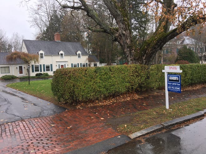 A home for sale on Arch Street in Dover this week. The median sales price on homes in Strafford County was up significantly this October, $260,000 versus $212,500 last year. [Deb Cram/Fosters.com]