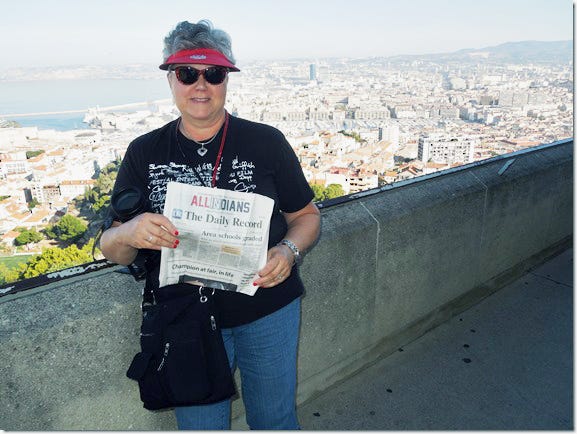 Marcella Hawkins of Holmes County took a retirement trip (retiring in January 2018) which included two days in Rome, a cruise to Naples, Italy; Messina, Sicily; Dubrovnik, Croatia; Kotor, Montenegro; Corfu, Greece; Corsica, France; Toulon, France; and two days in Barcelona.She stopped with her copy of The Daily Record at the Notre-Dame de la Garde, a Catholic basilica in Marseille, France. But the excitement of Hawkins' trip was the day after she got to Barcelona — the day of the Catalonian vote for independence from Spain. According to Hawkins, "there was a crowd of people outside of our hotel (which was locked down) who wanted to vote — one of the voting places was right across the street from our hotel. The riot police came in from Madrid to keep the people from voting. Two had large cutters and a sledge hammer — to take the voting box away. The crowd left our area and we were able to do a lot of sightseeing that day. We left the next day, and the day after that, the airport was shut down due to the rioting."