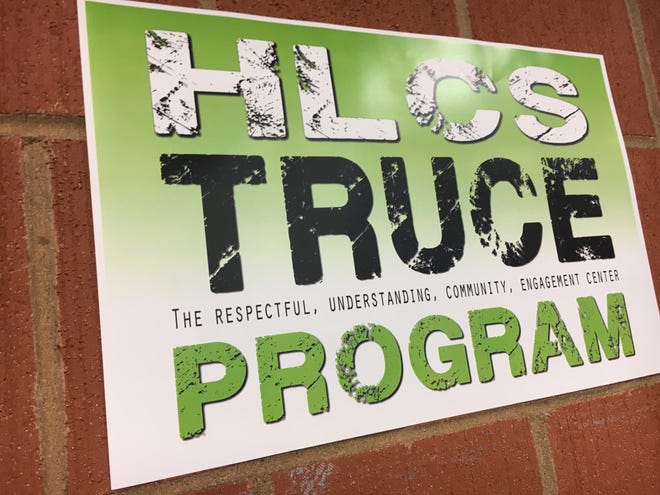 The signs for the new TRUCE Center were posted around the walls at Henry Lord Community School.