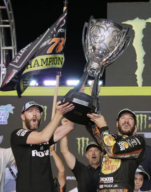 Crew Chief Cole Pearn, left, and driver Martin Truex Jr. won the 2017 Monster Energy NASCAR Cup with an exciting win over Kyle Busch at the season finale in Homestead Miami. Things could have been way different, however as our auto columnist explains in this week’s feature. [Bass Pro Shops/Furniture Row Racing]