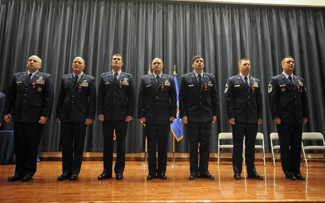 Bronze Star medal recipients: (from left) Col. Rhett D. Champagne, Lt. Col. Blaine L. Baker, Lt. Col. Robert Rayner, Capt. Jacob W. Becker, Capt. Andrew T. Schnell, Senior Master Sgt. Ricky B. Smith and Senior Master Sgt. Christopher W. Wright. The U.S. Air Force Expeditionary Center hosted the ceremony recognizing the men at Joint Base McGuire-Dix-Lakehurst on Tuesday, Nov. 21, 2017. [SCOTT ANDERSON / PHOTOJOURNALIST]