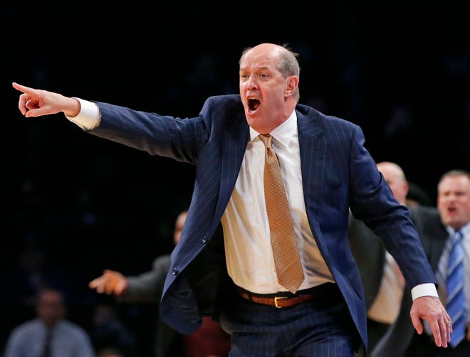 Pittsburgh head coach Kevin Stallings argues an official's call during the second half against Oklahoma State in the Legends Classic tournament, Tuesday. Oklahoma State defeated Pittsburgh 73-67. [AP Photo/Kathy Willens]
