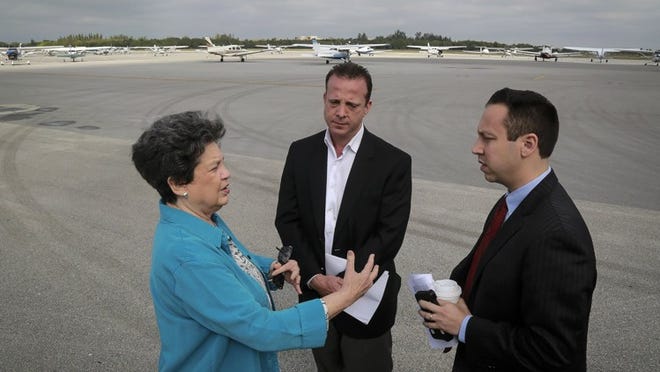 Jonathan Miller (center), CEO of Stellar Aviation Group, speaks with Congresswoman Lois Frankel (left) and Palm Beach County Commissioner Dave Kerner (right) Monday, Feb. 13, 2017, following a press briefing at Lantana Airport to discuss the impact on local aviation businesses during President Trump’s visits to Palm Beach County. Lantana Airport is listed the 10th busiest “general aviation” air facility in the nation. Local airport officials fear the president’s repeated visits to Palm Beach County this winter will them thousands of dollars (Bruce R. Bennett / The Palm Beach Post)