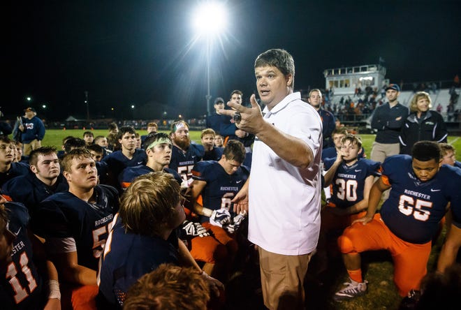 Rochester football coach Derek Leonard talks to his team after the Rockets defeated Belleville Althoff in the second round of the playoffs this season. [Justin L. Fowler/The State Journal-Register]