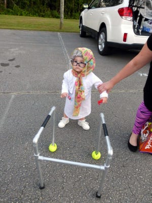 Trunk or Treat 1: One-year-old Jordan Spuehler was a hit with her “old granny” costume, complete with walker, at the Trunk or Treat event.