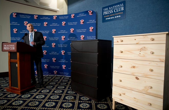 Consumer Product Safety Commission Chairman Elliot Kaye speaks during a 2016 news conference, with two Ikea dressers displayed at right. Ikea is relaunching a recall of 29 million chests and dressers after the death of an eighth child attributed to one of the dressers tipping over. [AP FILE]