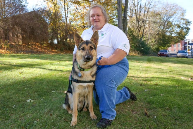 Penny Rowe, of Waynesboro, poses with Nathan, a German Shepherd puppy that is training to be a seeing eye dog.
